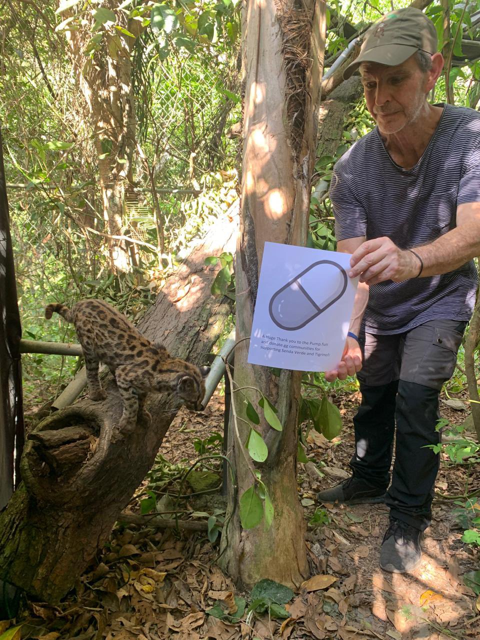 Marcelo Levy of La Senda Verde holding a printed thank-you sign next to Tigrino